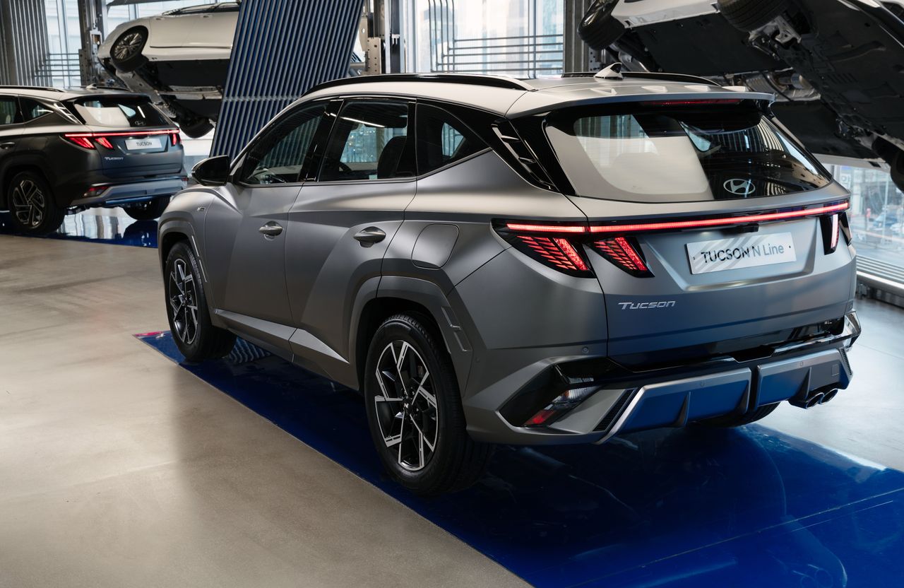 Hyundai Tucson N Line showcased in modern showroom setting with sleek design focus.