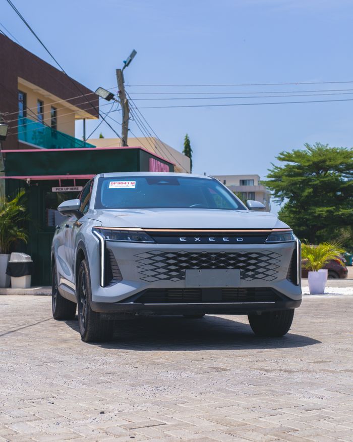 Stylish Exeed SUV parked outside on a sunny day under clear skies.